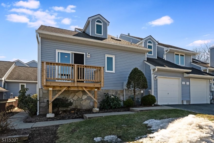 Bright, spacious and beautifully updated Muirfield model in the desirable West Essex Highlands community featuring a first-floor primary suite. The primary retreat offers tray ceilings, a large walk-in closet and an updated spa-like bath, along with access to a recently renovated deck. The eat-in kitchen features stainless steel appliances and granite countertops and flows into the expansive living and dining areas. The living room is anchored by a gas fireplace and sliding doors that open to a second renovated deck surrounded by peaceful wooded views. A newly renovated powder room completes the main level. Upstairs, a spacious loft provides flexible living space and is accompanied by a home office/bedroom and an additional bedroom that shares a generous hall bath. The full basement offers excellent potential for future living space, recreation or storage. Residents enjoy the amenities of West Essex Highlands, including a clubhouse, outdoor pool and tennis courts, all within a beautifully maintained community.