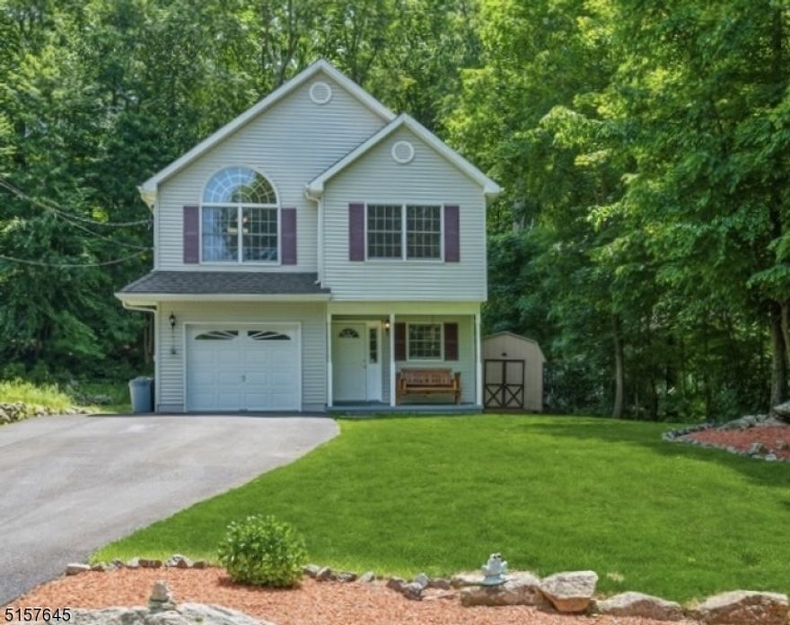 Live "the lake life" in this spacious, custom Raised Ranch 3B + den/office, 2 1/2 Bth & attached 1-car garage near NJ's largest freshwater lake. Nestled in the scenic Lake Winona Community of Lake Hopatcong, you'll feel like you're on vacation year-round w/hiking, boating & swimming activities in the summer, along w/skating & ice fishing in winter. Situated on a manicured lot on a quiet road, offering a peaceful retreat from the busier main part of the lake yet still close to RTs15 & 80, the Dover train station, restaurants, beach clubhouse & walkable marinas where you can dock your boat. A charming front porch welcomes you inside to the ground-level foyer opening to a very large, sunny FR. Sliding glass doors lead to deck overlooking the private backyard w/views of the woods beyond. This level also includes a 1/2 Bth, laundry room, direct access to the attached garage & an extra room that can be used as a den/ofc, playroom, or guest-room for your summertime visitors! Upstairs main level is open & airy w/vaulted ceilings, hardwood floors & huge windows bringing in abundant natural light. The layout includes a large LR, a formal dining area & an open kitchen w/ample cabinet & counter space. Down the hall is the Primary Bd w/a full en suite Bth, 2 nicely-sized addt'l Bs & a full hallway Bth. This home also has central AC/heat & a storage shed complete the package of this truly immaculate move-in-ready home set in a cozy lake community. Association Dues are ANNUAL, not monthly!