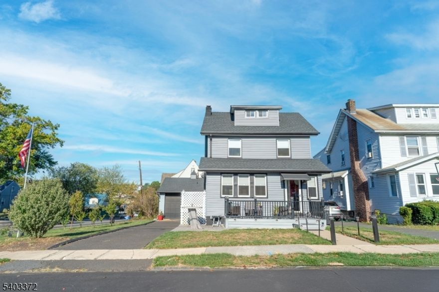 This beautifully renovated colonial sits on a LARGE CORNER LOT.  With recent modern updates throughout including the kitchen, one and a half baths, fully finished attic, electric and recessed lighting along with three spacious bedrooms and lots of closets designed for both style and comfort. The inviting living room features a cozy wood-burning fireplace, creating the perfect setting for relaxing evenings or gatherings with friends. A brand-new Trex porch welcomes you at the front, while a new Trex deck in the back provides the ideal space for outdoor dining and entertaining. The full basement offers substantial storage. Every detail has been thoughtfully updated, blending classic design with contemporary finishes for a truly move-in ready experience. An oversized  detached 2 car garage and a driveway allow for ample parking. Located in a walkable community known for its small-town feel and easy access to parks, local shops, and restaurants, the home also offers a convenient commute to New York City. Riverside County Park and the Passaic River are nearby, giving you plenty of opportunities for recreation and leisure.  Don't miss the chance to make this stunning home your own.