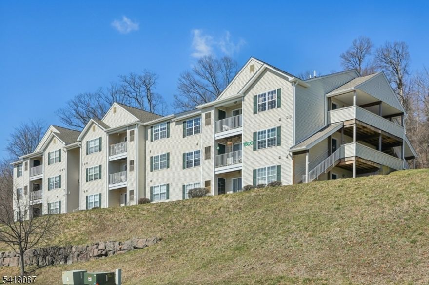 Enjoy the convenience of one floor living in this well laid out two bedroom, two bath end unit at The Woods at King Court. This unit offers an open and functional floor plan with spacious living and dining areas and an open kitchen, perfect for everyday living or entertaining. Sliding doors from the living room lead to an outside covered patio and storage closet. The primary bedroom features an en-suite bath and walk-in closet. The second bedroom with a double closet is conveniently situated next to the second full bathroom. There are two more double closets in the entryway and hallway. Laundry room is equipped with a newer washer and dryer and extra storage space. Freshly painted and newer flooring and carpeting throughout. Private and quiet cul-de-sac location with spectacular views. One assigned parking spot and ample additional guest parking. Ideally situated near major highways, shopping, dining, and everyday conveniences.