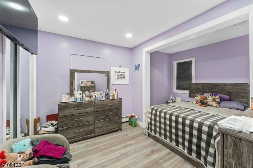 Well maintained multi family home in a desirable Carteret location, situated on a fenced corner lot with generous outdoor space and approximately 20"25 minutes to NYC. Roof and siding replaced in 2025. Unit 1 offers 1 bedroom, 1 bath, living and dining areas with backyard access; Unit 2 features 2 bedrooms, 1 bath, living and dining areas, porch, and backyard access. The home also includes a finished basement with walk-out access and a finished attic, providing additional finished areas. Spacious backyard with deck and above-ground pool, ideal for entertaining. Great opportunity for owner occupants or investors.