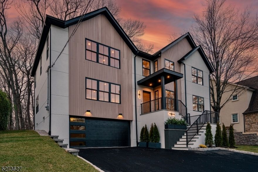 Welcome home, where modern luxury meets timeless elegance. This contemporary masterpiece is newly built from the foundation up and offers sophisticated living with high-end finishes and meticulous attention to detail. Boasting 5 Beds and 5.5 Baths sprawled over 3500 SF. Step inside to be greeted by natural oak 4" plank hardwood floors, complemented by a stunning open-rise staircase. The thoughtfully designed layout features 3 ensuite bedrooms, including one on the 1st floor. The custom chef's kitchen offers high-end JennAir appliances, a smart 6-burner gas stove, a built-in microwave/speed oven, a wine cooler, quartz countertops, a waterfall island with a 4-seat setting, and additional cabinets for extra storage. An open-concept sun-lit dining room offers plenty of space for gatherings with friends. Across the hall, the family room beckons relaxation with its cozy gas fireplace, accent wall, and expansive windows for plenty of natural light. Discover a large deck overlooking the private backyard that backs up to a park-like wooded setting, offering serenity and privacy. Additional highlights include efficient 2-unit, 3-zone HVAC, a recirculating pump for instant hot water, an oversized 2-car garage, an open concept game room, and a full bath on the ground level. Excellent schools, a beautiful downtown, a strong sense of community, a convenient commute to NYC and Newark airport, and several parks are only a few reasons to move to Westfield.1-2-10 Year Home Warranty is included