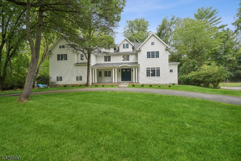 Discover this extraordinary custom-built home featuring 6 bedrooms and 5.2 bathrooms, situated in the highly sought-after Deerfield neighborhood on a serene, flat property. This home offers a spacious and welcoming open floor plan, highlighted by an expansive family room with grand windows that frame views of the beautifully manicured, level backyard. The sunlit formal dining room, conveniently located off the kitchen, enhances the home's inviting atmosphere. The custom kitchen is outfitted with premium Subzero and Wolf appliances, ensuring a top-tier culinary experience. On the first floor, you'll find a bright and generously sized bedroom with its own full bathroom. The large office space provides a perfect retreat for both work and relaxation. The master suite is a luxurious haven, featuring a roomy walk-in closets and a spa-like bathroom. The lower level is thoughtfully finished with a large recreation area, an additional bathroom, and an exercise room. The flat yard is ideal for entertaining outdoors.