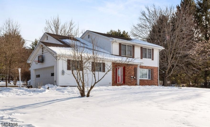 Beautiful, peaceful home location with view of farmland across the street. Close to Route 78 for commuting convenience. You will find this spacious 4 bedroom, 2 1/2 bath colonial move-in ready. Large deck, great for entertaining, overlooks private large backyard. Three sheds for extra storage. Newer roof, furnace and AC system. Partially finished basement with office space. Security closed circuit TV cameras and monitors will be included in the sale. Two pellet stoves to help heat the home. Septic cleaned and checked 1/19/2026. Quick close possible. Come on out to the country!