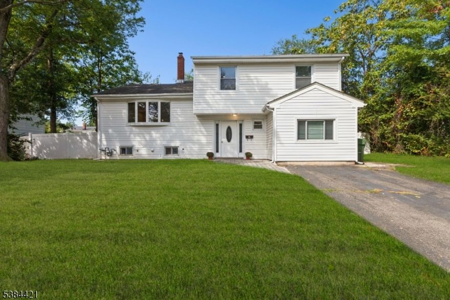 Stunning East facing renovated split-level home featuring 4 spacious bedrooms and 2.5 bathrooms. Primary bedroom includes a full bath, while an additional full bath and convenient half bath serve the rest of the home.Brand-new kitchen with stainless steel appliances, modern cabinetry, and sleek countertops, flowing into a large eat-in area and family room. The formal dining room and bright living room offer ideal spaces for entertaining. Sliding doors to a private backyard with a paver patio. Additional highlights include new flooring and bathrooms,roof is 5 years old, and a 2-year-old central air system. On a quiet street in a highly sought-after Edison neighborhood, this home is close to top-rated schools, transportation, shopping, and dining.