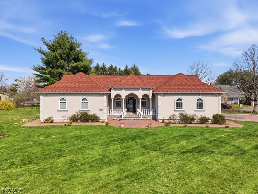 Exceptional Mediterranean-style ranch set on 1.23 private acres directly across from preserved land, delivering unmatched privacy, views, and curb appeal. This custom-built home showcases a tile-style roof, stucco exterior, arched windows, and a grand portico entrance. Inside, you're welcomed by soaring 14' cathedral ceilings, Andersen windows, and a sun-filled open layout designed for modern living. The showpiece chef's kitchen features a massive granite island, pot filler, premium stainless appliances, and custom cabinetry perfect for entertaining. Offering 3 spacious bedrooms, 2.1 baths, and generous storage throughout. All major systems have been thoughtfully upgraded for today's lifestyle. Complete with a 2-car garage, huge driveway, and a peaceful backyard setting. A rare opportunity homes like this don't come around often.