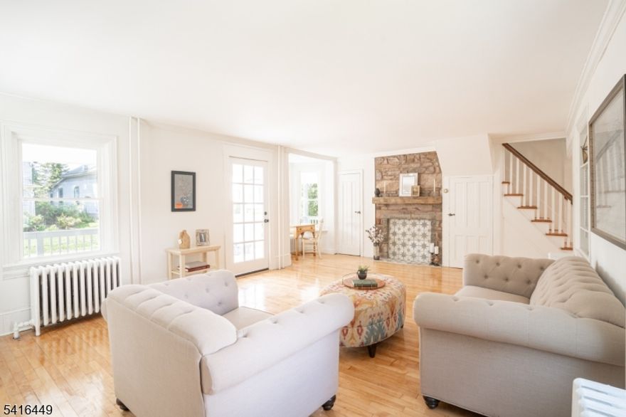 In the heart of darling, historic Rosemont Village, don't miss where old charm meets modern amenities. Renovated top to bottom, this beautiful home has it all. Minutes from the bustling "River towns" of Stockton, Lambertville, New Hope and Frenchtown but quietly tucked up in a country village setting. You'll see why the last owners stayed for over 40 years (and most of the neighbors have been there for decades). With 4 spacious bedrooms & 3.5 remodeled baths, this 3000 SF home has a surprising amount of space & storage. The primary en suite w/ walk-in closet and stunning marble bathroom also includes a second flex room, with another closet and built-in shelving. Whether you need a play room, a home office, a home gym or something else entirely- this en suite has you covered. On the third floor is a third full bath and two additional generously sized bedrooms, each complete w/ WIC &  laundry chutes to the 2nd floor laundry rm. Back down the wooden winding steps, is a beautifully remodeled kitchen with quartz countertops, SS appliances and open floor plan to dining area. Thoughtfully updated w/ new roof, multi zone AC/heating, refinished hardwoods, new windows, updated wraparound porch, & more. Large historic barn w/ endless possibility could be converted to a hobby room, 2-car garage, workshop or guest space. A unique opportunity to own a historic property with modern conveniences. Schedule your showing and see your future home TODAY!