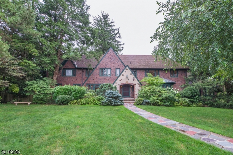 Rich in history and steeped in modern glory this gracious Tudor set on almost an acre is positioned to take full advantage of all this thriving community has to offer: sought after Millburn Schools, restaurants, shopping and NYC trains. CH Colonial-like layout with formal LR, DR, Sun Rm & Kitchen w/ adjacent FR on the main floor as well as 1 BR and 1.5 Baths. 4 BRs & 3 Baths on the 2nd flr including Owner s suite w/ full bath, dressing room and closet. Charming reading nook off the landing. Finished LL with Rec Room, Speakeasy with French Doors leading to the patio, Powder Rm and a Laundry Rm. Attached oversized 2 car garage with adjacent storage room. Secluded screened in porch off the FR overlooks a very private yard with a large patio and in-ground pool perfect for entertainment and everyday living.