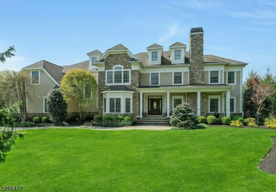 Nestled in Franklin Lakes, this captivating Nantucket-inspired residence embodies timeless elegance on a sprawling 1-acre property. This exquisite home offers both luxury & comfort. Its exterior features stone & hardiplank, expansive windows & picturesque landscaping, creating a welcoming ambiance. The interior is adorned with high-end finishes, rich hardwood flooring, intricate moldings & designer touches. The spacious floor plan seamlessly blends traditional charm with modern amenities, providing the perfect setting for both intimate gatherings & grand entertaining. The gourmet kitchen is a chef's delight with top-of-the-line appliances, custom cabinetry, & a large center island. Each bedroom ensuite is a peaceful retreat with ample natural light, The lush grounds offer a private oasis, manicured lawns & a tranquil patio ideal for al fresco dining or relaxation. This remarkable property epitomizes luxurious living & offers a rare combination of sophistication, serenity & style!