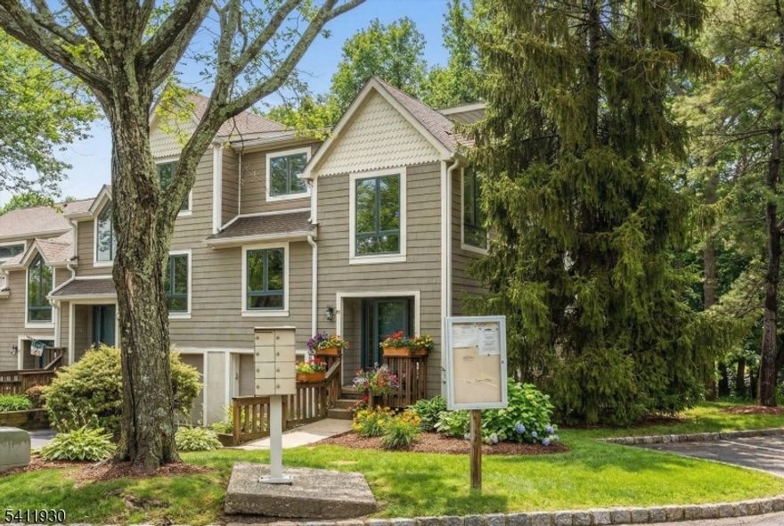 One of the most desirable layouts in Glen Pond, this end-unit townhome offers the second largest floorplan in the community with over 2,100 sq ft across three full levels. Bright and airy with an extra wall of windows, natural light pours into every level of this lovingly maintained home. The main floor features expansive living and dining spaces, a welcoming family room with cozy two-sided fireplace, and sliding doors to a private deck overlooking a peaceful wooded setting ideal for entertaining or quiet mornings outdoors. The kitchen features double wall ovens, granite countertops, tile backsplash and a peninsula with seating. Upstairs, the top level includes three bedrooms and two full baths. The spacious primary suite boasts a large bedroom, dressing area with vanity, a private bath complete with skylit shower and soaking tub as well as a WIC and 3 additional closets. The finished lower level offers exceptional flexibility with a full bath, office/bedroom with WIC and sliding doors providing exterior access -- perfect layout for guests or home office. New roof in 2023, central air, generous room sizes, and easy townhouse living in a prime location near Routes 3, 46, 23, 80 and the GSP with plentiful shopping, dining, and NYC transportation options.