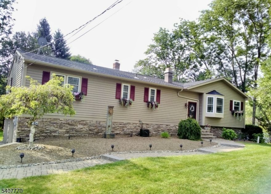 STOP YOUR SEARCH! THIS IS THE ONE! SPECTACULAR, CUSTOM, EXPANDED 4BD 2.5BTH RANCH NESTLED ON PARKLIKE GROUNDS IN ONE OF VERNON TWP.'S MOST SOUGHT AFTER ENCLAVES!  MINUTES TO NJ TRANSIT BUS LINES & ROUTES 23 & 287!*APPROXIMATELY 2000 SQUARE FEET + FULL/DAYLIGHT/WALK-OUT FINISHED LOWER LEVEL APPROX 900 SQ FT*METICULOUSLY UPDATED & MAINTAINED WITH A TRUE EYE FOR DETAIL! (HOME HAS BEEN COMPLETELY REDONE OVER THE LAST 8 YEARS)  FEATURES/UPDATES INCLD NEW/NEWER: KITCHEN WITH GORGEOUS GRANITE, STAINLESS STEEL APPLIANCES & CUSTOM BACKSPLASH, ALL APPLIANCES INCLD, GLEAMING HARDWOOD FLOORS, EXPD FRML DINING ROOM WITH CSTM NOOK, OPEN/ AIRY FLR-PLAN, CUSTOM- GLASS ATRIUM/DEN W WD-BURNING STOVE FOR ALL THE FEELS, NEW CERAMIC TILE BATHS-DIVINE DESIGN, 2ND WOOD BURNING FIREPLACE IN THE FAM RM, NEW WINDOWS, 14 X 20 NEW SPACIOUS TREX DECK WITH HARD WIRED CUSTOM LIGHTING PACKAGE & 5 FT WIDE STAIR CASE, NEW SIDING, GUTTERS & ROOF, NEW CUSTOM SHADES & BLINDS STAY, NEW CARPETING IN BEDROOMS, NEW PROFESSIONAL LANDSCAPING & PAVER WALKWAY, NEW HT WATER HEATER, NEW WELL TANK, FURNACE WAS COMPLETELY REFURBISHED, NEW WELL HEAD, BSMENT FRIDGE STAYS, GENERATOR WITH DEDICATED PLUG INCLD IN SALE, BAR IN FAMILY ROOM STAYS & NEW SEPTIC 2009! *NATURAL GAS THROUGH ELIZABETH TOWN GAS* MINUTES TO CRYSTAL SPRINGS RESORT, GOLF, SKI, WATER PARK, RESTAURANTS, HORSEBACK RIDING, SHOPPING, HIKING, BIKING, FISHING, FARM TO TABLE STANDS! PLENTIFUL STORAGE! *CHIMNEYS ARE, "AS IS", NO KNOWN ISSUES***H & B by 3/2 @ 2pm***