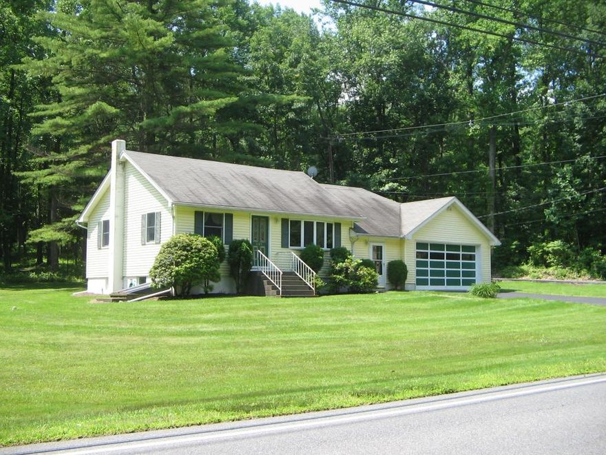 Welcome to this elegant 5-bedroom, 5.1-bath Colonial that blends timeless charm with modern luxury. An inviting open front porch sets the tone for what's inside a beautifully crafted home with an open floor plan, rich hardwood floors, abundant natural light and exquisite custom woodwork & architectural details throughout. Step into the impressive 2-story foyer, flanked by a formal living room & a sophisticated dining room complete w/butler's pantry. The gourmet eat-in kitchen is a chef's dream, featuring granite countertops, center island w/sink, SS appliances, pantry & separate dining area. The kitchen seamlessly opens to the dramatic 2-story family room, showcasing a vaulted ceiling, wood fireplace, built-ins & Palladian windows. The 1st floor also includes a private bedroom w/full bath as well as a laundry room & powder room for added convenience. Upstairs, the luxurious primary suite boasts a vaulted ceiling, sitting room w/gas fireplace w/built-ins, custom WIC & spa-like bath w/dual sinks, jetted tub & stall shower. Also  on the 2nd floor are an en-suite bedroom w/private bath & two additional bedrooms that share a Jack-and-Jill bath. The finished lower level offers even more living space with a rec room, media room & full bath perfect for entertaining or relaxing. Outside, enjoy the professionally landscaped, fenced backyard w/paver patio & built-in BBQ ideal for gatherings. Conveniently located near NYC transportation, this home offers both comfort and connectivity.