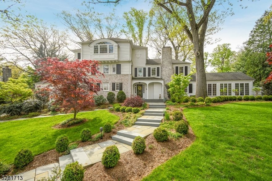 Location. Location. Location! Poised on a half acre in Summit's prime Woodland Park neighborhood, this outstanding custom Colonial home boasts stately elegance and suburban living at its finest.  Extensive renovations throughout the first two floors include a 2017 designer kitchen and baths, primary bedroom, great room, home office, and more. Distinctive wide-plank reclaimed wood floors run throughout the first floor rooms to create a lovely blend of rustic and modern elements.