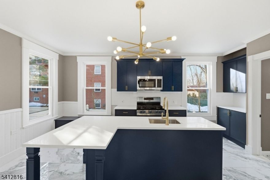 Experience the best of modern living in this beautifully renovated Colonial-style home, where timeless charm meets high-end contemporary finishes. As you step inside, you are greeted by gleaming hardwood floors and an open, inviting floor plan bathed in an abundance of natural light. The heart of the home is the brand-new designer kitchen, featuring elegant quartz countertops, sleek stainless steel appliances, and a spacious center island with seating that is perfect for casual meals or entertaining guests.This thoughtfully updated residence offers four spacious bedrooms and two full, modern bathrooms, ensuring comfort and style for everyone. The interior also features a full unfinished basement, providing excellent potential for additional storage or future customization. Step outside to your freshly painted backyard deck, an ideal spot for summer barbecues or a peaceful morning coffee.The location is truly unbeatable for those seeking a vibrant lifestyle. You are just minutes from the heart of downtown Somerville, renowned for its diverse collection of restaurants, cozy coffee houses, and boutique shops. Commuters will appreciate the close proximity to local hospitals, major highways, and a nearby train station with a direct line to NYC. This move-in-ready gem offers the perfect blend of suburban tranquility and urban convenience in one of Central Jersey's most sought-after areas.