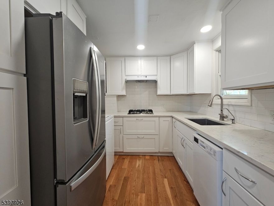 Large 1 bedroom apartment in great location. Water and sewer included in rent. Washer/dryer in unit. Off-street parking. Porch, yard and shed storage. New flooring, renovated kitchen and bath. All appliances included. Refrigerator with ice maker. Drinking water system. Garbage disposal in sink. Bathroom with shower over tub and large three sided vanity. Tons of natural light for indoor plants. Tankless hot water heater providing endless hot water. Fenced in back yard perfect for pets. Fire pit, covered porch with outdoor sitting area backing to woods with plenty of nature. Mountain view from kitchen with trees and hiking trails. Steps to public transportation, town center, shopping and restaurants. Move-in ready. Pets welcomed. Recently renovated as shown. Pictures with furniture are included for placement purposes.