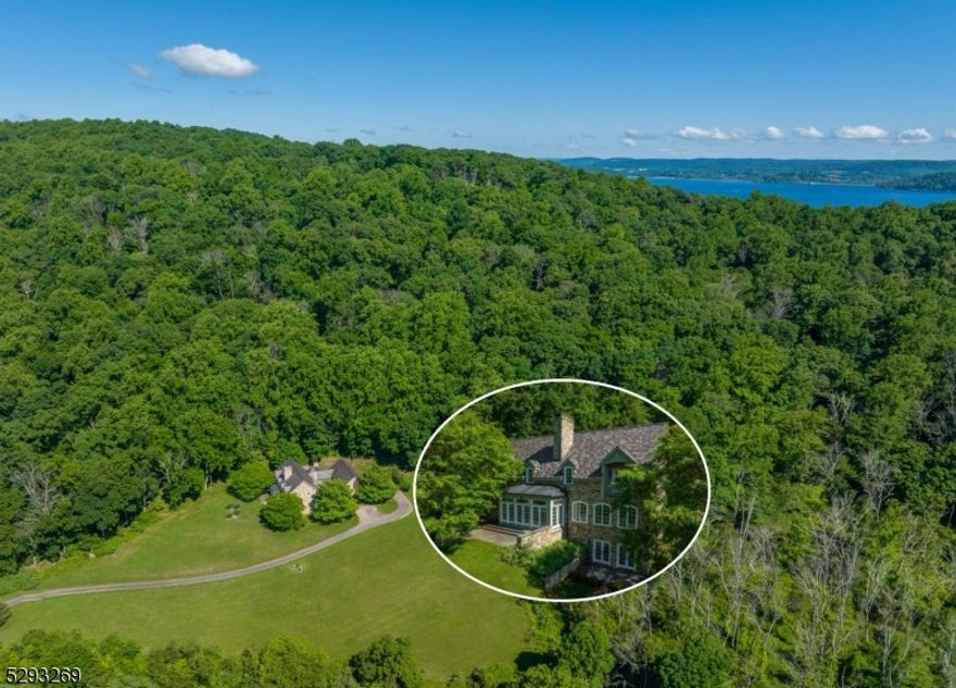 NO EXPENSES WERE SPARED IN CREATING THIS MAGNIFICENT TOTALLY PRIVATE CUSTOM DESIGNED AND BUILT 5511 SQ FT 4BR & 4 FULL & 2 HALF BATH STONE MANOR HOME METICULOUSLY CONSTRUCTED WITH STRICT ATTENTION TO QUALITY AND DETAIL ON A GORGEOUSLY LANDSCAPED 6.02AC WOODED LOT WITH SWEEPING SOUTHERLY VIEWS & TOTALLY SURROUNDED BY ADDITIONAL PRESERVED WOODLANDS FOR COMPLETE PRIVACY. THIS SURPRISINGLY WARM-AND-INVITING HOME WAS BUILT LIKE A HILLTOP FORTRESS WITH PERFECTLY-SET INDIVIDUALLY HAND-CHISELED STONE BLOCKS BY OLD WORLD CRAFTSMEN, AND A TOP SHELF VERMONT SLATE ROOF WITH COPPER ACCENTS AND GUTTERS. THIS ONE-OF-A-KIND RESIDENCE ALSO FEATURES A GREAT OPEN FLOOR PLAN WITH SPECTACULAR VIEWS FROM AN ENORMOUS MULTI-WINDOWED FAMILY RM WHICH OPENS ONTO A HUGE SLATE PATIO BORDERED BY SEAT-LEVEL STONE WALLS, A LARGE FULLY-WINDOWED SUN ROOM WHICH OPENS ONTO ITS OWN TERRACE, AN 18X17 DINING ROOM WITH A MAHOGANY TABLE, AND A CUSTOM-DESIGNED KITCHEN WITH WHITE COUNTRY PINE CABINETRY, BLACK ABSOLUTE GRANITE COUNTERS, AND UPGRADED WHITE ENAMEL APPLIANCES. OTHER HIGHLIGHTS INCLUDE A CATHEDRAL CEILING LIBRARY, VIEW BALCONIES IN EACH BEDROOM, HIS-AND-HERS MASTER BATHS, A FINISHED WALK-OUT LOWER LEVEL ENTERTAINMENT CENTER, FOUR FIREPLACES, A 4-CAR GARAGE, 26" WINDOW WELLS AND EXPOSED STONE IN MOST ROOMS, RADIANT HEATED FLOORS ON ALL LEVELS, GASLIGHT LANTERNS IN THE GATED COURTYARD, AND A TRULY GREAT LOCATION CLOSE TO NEARBY STANTON RIDGE COUNTRY CLUB, ROUND VALLEY RESERVOIR, AND AN EASY COMMUTE TO RT 78.