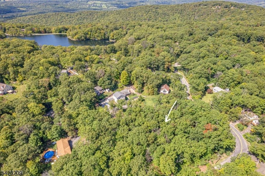 Welcome to Lake Panorama! Fantastic opportunity to own land in this beautiful Lake Community, with the potential to build. This lot offers a beautiful setting and great access to all that Lake Panorama has to offer. Bonus Opportunity: The adjacent lot at 7 Splitrock Lane is also available! Sellers are open to bundling both lots for a discounted price if purchased together, don't miss this chance to expand your space and save. Whether you're looking to invest, build, or simply enjoy the lake lifestyle, this is a deal worth exploring!