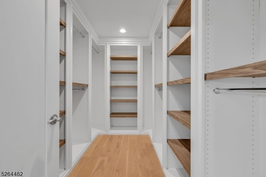 This 6BD 5.5BA Custom Colonial home built by RODAK HOMES w 4600+/- sf of finished living space over 3 floors features a 2 story foyer, gorgeous hardwood wide plank flooring throughout with extensive trim, custom millwork & finished closets. Home includes a formal Living Room/Dining Room, expansive Kitchen, Family Room w electric fireplace & sliders to paver patio. The Kitchen is complete with high-end SS appliances including 48" sub zero fridge and 36" wolf range, large center island with 1 sided waterfall, quartz counters & ceiling height cabinetry. The 1st floor en-suite for guests/office, powder room & mudroom complete the first floor. The 2nd floor is home to 4 Bedrooms including an en-suite, 3 Bathrooms & Laundry. Primary Suite is complete with large custom walk-in closet, spa-like bath with a soaking tub, stall shower & dual sinks. Full finished, walk-out basement with Bedroom, large Rec Room with built-in bar & full Bath. 10 YEAR BUILDER WARRANTY