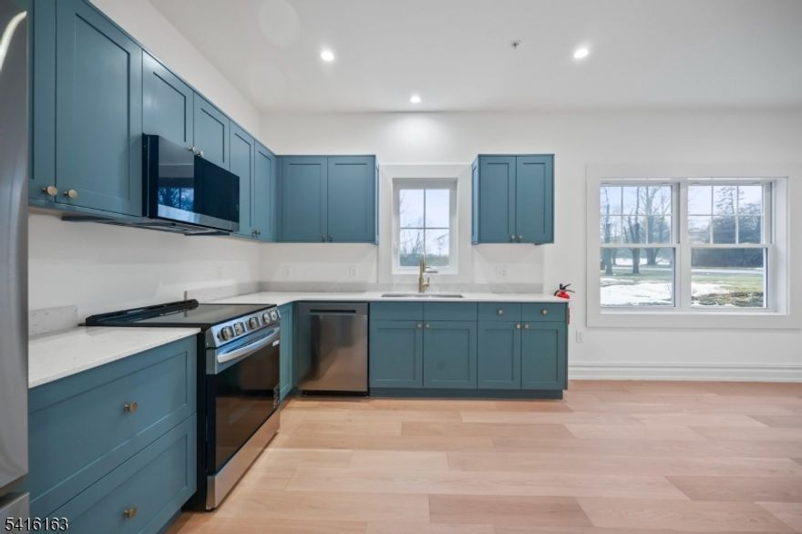 Welcome to 1209 Littleton Road! Truly high-end! A brand-new, modern, and spacious residence in a beautifully designed multifamily building. This 2-bedroom, 1 and 1/5 baths apartment combines contemporary style, comfort, and convenience in a quiet setting while keeping you close to everything you need. This bright and thoughtfully designed unit features beautiful wood floors, soundproof construction, and large windows that fill the space with natural light. The modern kitchen is equipped with premium LG appliances and excellent storage. The home is also smartphone integrated. Additional features include washer and dryer in unit and two parking spaces. Excellent location: Located across the street from the high school and just around the corner from the elementary school, this property is also close to restaurants, parks, houses of worship, gyms, and everyday conveniences. Easy NYC commute; convenient access to train and bus routes to New York City, making commuting simple.1209 Littleton Road is the perfect balance; close enough to major roads for convenience, yet set back enough to enjoy the quiet and comfort this apartment offers. Renter's insurance required. Credit check, income & employment verification required. A background report is required for all applicants 18 years and older