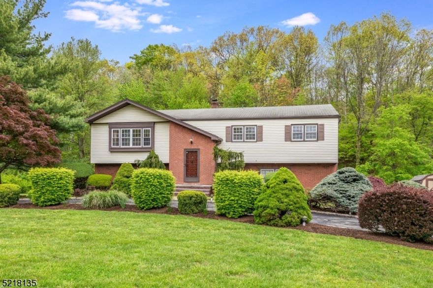 4 Bedroom Bi-level in the highly desirable Whippany section of Hanover Township known for low taxes & excellent schools. Situated on a large, flat, partially fenced 1.26 acre lot. Generous sized LR & DR provides great spaces for gatherings. The home features a kitchen with a gas cooktop, backsplash &  plenty of counters & cabinets An expansive deck just off the kitchen allows for outdoor dining & entertaining. Hardwood floors throughout the main level & vinyl window. Primary bedroom with a walk-in closet & a full updated bath. Two additional good-sized bedrooms & a hallway full bathroom. The ground level provides additional living space with a bedroom, oversized family room, 1/2 bath & laundry room. The family room has sliders to a covered patio. A private backyard awaits you.The circular driveway and 2 car garage offer tons of extra parking. Oversized 2 car garage with plenty of room for cars and storage. Hanover Township is known for low taxes & excellent schools. Township has a beautiful town pool (additional fee), community center, before/after school programs, various sports programs and much more. Easy access to the Convent Station with NYC Midtown Direct Train. Short ride into downtown Morristown with restaurants, shops & theatre. Convenient to major highways.