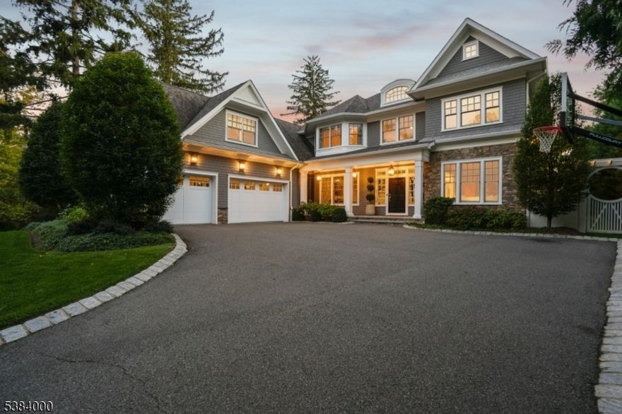 Custom, Chic & Perfect! Welcome to 49 Woodcrest Avenue, a bespoke 6BR, 6.2BA Colonial ideally located on a private road in Short Hills, close to downtown and the NYC train. Elegant yet comfortable, perfect for everyday living, indoors or out. Step into the breathtaking foyer with soaring 10' ceilings and feel the spaciousness throughout. Relax in the inviting living room or host guests in the formal dining room. The open-concept kitchen and family room are flooded with natural light from oversized glass doors. The chef's kitchen features 3 Wolf ovens, a Wolf range, Sub-Zero fridge, refrigerated drawers, 2 Bosch dishwashers, microwave drawer and water filtration. Entertain effortlessly with Sonos throughout the first floor, patio, and pavilion. Enjoy a custom bar, built-ins, formal/informal powder rooms, large pantry, and mudroom. French doors lead to a backyard oasis with heated saltwater pool (auto cover rated for an elephant!), pavilion with grill, TV, fridge, fireplace, fenced yard, and oversized car garage. A tucked-away guest suite offers peaceful backyard views. Upstairs, the luxurious primary suite includes a spa-like bath, 2 California closets, one with a glass-topped island (Carrie Bradshaw would be jealous) and a private office. All bedrooms are en-suite with custom baths. The finished basement offers a bunk room, gym, rec space, full bath. (Room for wine cellar/wellness area.) Thoughtfully designed to offer luxury, comfort, and effortless sophistication!