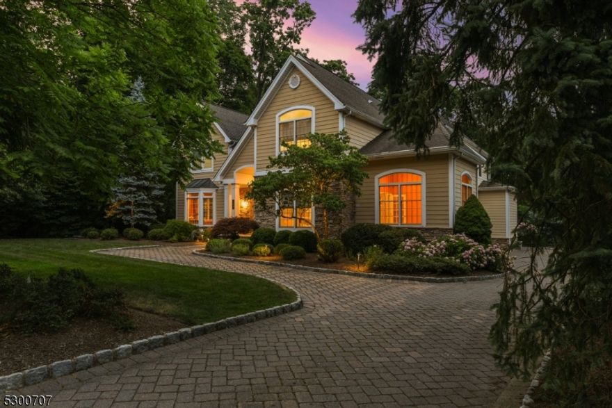 Welcome to luxury living at its finest! Nestled in a prestigious section of Short Hills, this exquisite 5 BR/4.2BTH home offers unparalleled elegance & modern comfort. Newly built 2004 &  recently renovated throughout, this home boasts impeccable craftsmanship & attention to detail. Enter the 2-story foyer w/ sweeping staircase to find DR w/ bar & LR where a beautiful two-sided fireplace connects to 1st flr office. Towards back, state-of-the-art kitchen, where no expense was spared on custom cabinetry, ss applncs (SubZero, Dacor) & granite counters, is totally open to spectacular family rm w/ fireplace. 1st flr BR suite, laundry rm, PR & 3-car garage (EV charger). 2nd Level: 4 more BRs radiate off main staircase. Lux primary suite w/ private sitting rm, vaulted ceiling, 2 WICs & spa-like bath w/ double vanities, heated flr, soaking tub & huge glass shower. LL is a Party-Lover's dream! Enormous, open plan: rec rm, pool table, ManCave bar w/ kegerator & bev fridge, gas fireplace, wine cellar, exercise rm & office. Outside: composite deck & new paver patio w/ fire pit overlook lushly landscaped property for amazing entertaining (room for a pool, too!). Amenities: hardwd flrs, speakers wired for Sonos, security systm, whole-house generator, newer windows, maintenance-free Hardi Plank siding, exterior lighting, new driveway turnaround, fenced yard, underground sprinklers. Close to town, top-rated schools (Deerfield) & NYC trains. This spectacular home awaits the next lucky owners.