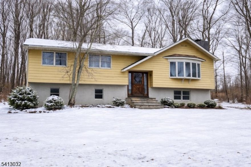 Coming Soon! This 4 bedroom, 2.5 bath oversized bi-level is set on over 2 private acres in a secluded location, yet within walking distance to town and Blair Falls, offering the perfect balance of privacy and convenience. The home features hardwood floors throughout, 4 zone heating and 3 wood burning fireplaces, including one in the primary bedroom. The entire interior has just been freshly painted, providing a bright, move-in-ready feel. The kitchen opens to a deck overlooking the backyard, ideal for entertaining or relaxing. Additional highlights include an oversized heated garage and spacious shed with lean-to, complete with electric and water. This is an estate sale and is being sold As-Is, with no known issues. Septic was inspected and repaired (D-box). This is a wonderful opportunity to make this home your own in a highly desirable setting. HIGHEST AND BEST DUE WEDNESDAY 3/4 BY 5PM