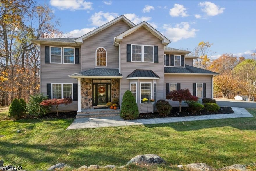 Stunning Custom Colonial in Desirable Dorchester Manor!  Welcome to this elegant Colonial featuring 4 spacious bedrooms, 2 full baths, and 2 half baths, offering both style and comfort for today's lifestyle. Step into the impressive two-story foyer with custom trim, setting a sophisticated tone that flows throughout the home. The main floor includes rich hardwood floors, a formal living room with pocket doors opening to a cozy family room, and a formal dining room perfect for gatherings. The eat-in kitchen boasts granite countertops, stainless steel appliances, breakfast bar, and ample space for casual dining. Enjoy relaxing by one of the three fireplaces, including one in the family room, which opens to a generous deck via French doors. The second floor hosts a primary suite with double-door entry, a warm fireplace in a sitting area, and an en-suite bath with double sinks and stall shower. Three additional generous size bedrooms, a hall bathroom, and a  convenience second-floor laundry room complete this level. The finished lower level includes a versatile recreation room with a free standing wood-burning stove, an exercise room, and a half bath perfect for extra living space. Outside, the expansive deck overlooks a private, tranquil yard, ideal for relaxation or entertaining. This home combines thoughtful design, modern upgrades, and a prime commuter-friendly location.