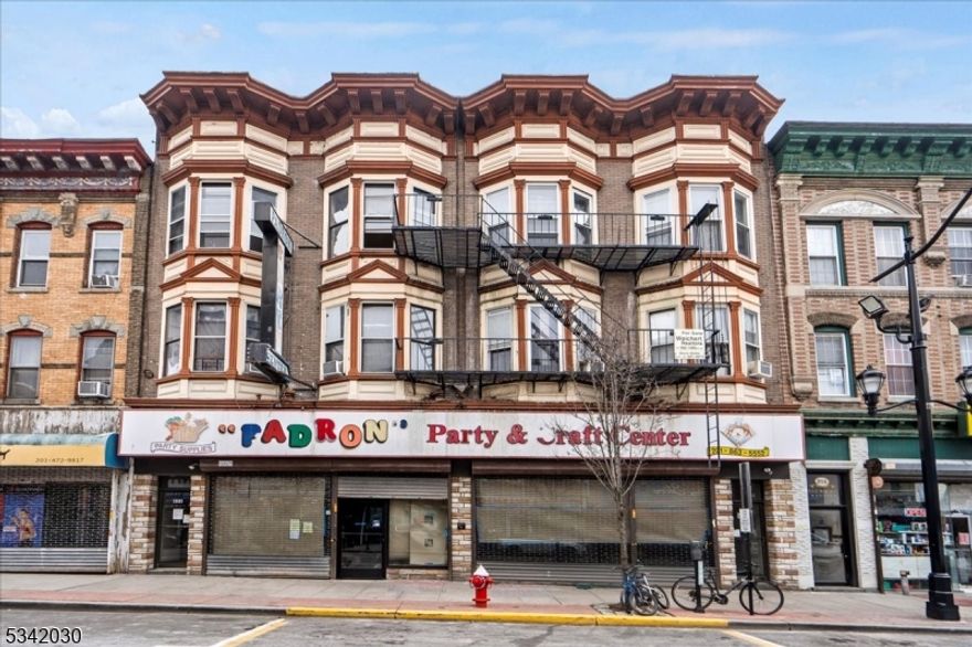 Commercial Mixed-Use. Prime Investment Opportunity in Union City, NJ, featuring 10 res units and 1 com space (approx. 4,200 SF) that can be used as 1 large store or 2 separate stores. Located in a highly desirable area w/ heavy foot traffic, the commercial space is fully equipped with 2 separate HVAC units (5 tons each), 2 electric panels, and 2 ADA bathrooms. The store also features new plumbing, electric, and HVAC, ensuring a modern and efficient setup. Currently under construction, it offers a unique opportunity for customization. The property includes a high-ceiling basement, providing additional storage or functional space. The res units have a new boiler, and common areas were renovated in 2025. 2025 total assessed value: $2,262,000. Opportunity to install telecom towers for additional income and prior discussions with an architect for adding 4-6 extra residential units make this an exceptional investment opportunity. Buyer to do their own due diligence.