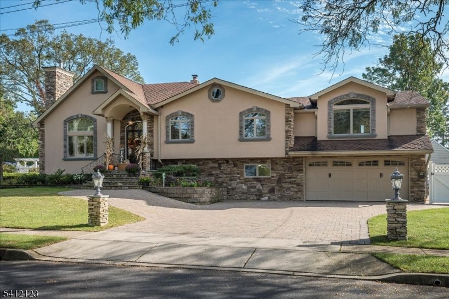 *Multiple offers have been received. Seller requests all Highest & Best Offers by Thurs. March 5th, 5pm* Spectacular custom home featuring a stunning stucco and stone fa ade, brick paver driveway, and walkway. The impressive two-story living room showcases a dramatic stone accent wall with fireplace, while the custom modern eat-in kitchen offers vaulted ceilings, an oversized center island, granite countertops, and top-of-the-line appliances. A formal dining room with coffered ceilings adds elegance for entertaining. The primary suite includes two walk-in closets and a luxurious spa-like bath, plus a third-level loft/office for added flexibility. The walk-out family room features a fireplace and wet bar, and the finished basement includes a dedicated laundry room. Additional highlights include recessed lighting, custom paint and trim throughout, central air, and multi-zone heating. Step outside to your own private backyard oasis complete with a covered brick paver patio, fenced heated in-ground pool with newer liner, and playground area. Fabulous location with desirable schools and just minutes to shopping, restaurants, and NJ Transit. A truly exceptional home that must be seen to be appreciated!