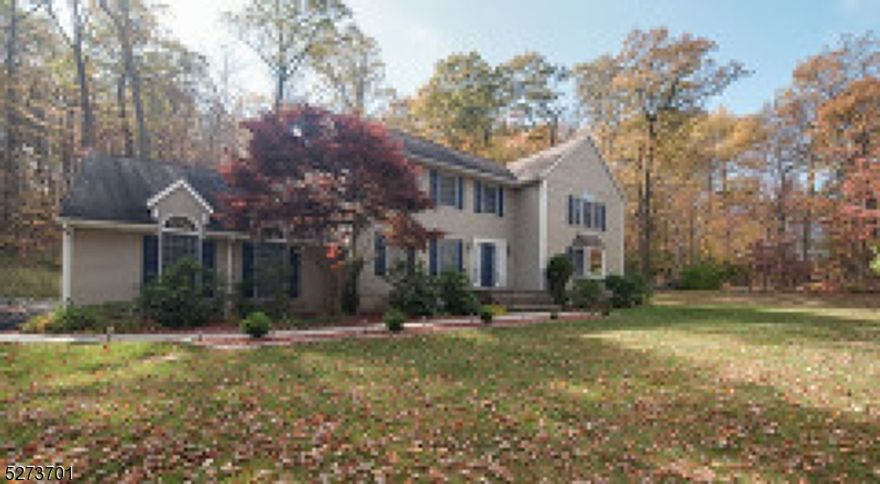 NOT VACANT- DO NOT DRIVE UP DRIVEWAY WITHOUT A CONFIRMED APPT. Don't miss this beautifully maintained 4-bedroom colonial! Step into the heart of the home, a fully renovated kitchen boasting Stainless Steel appliances, Quartz counters, a center island, chic tile back-splash, and sliders leading to an expansive entertainment-sized deck, perfect for outdoor gatherings. Adjacent is a spacious family room adorned with a wood-burning fireplace, hardwood floors, and French doors opening onto the deck, providing picturesque views of the lushly landscaped, park-like property. Also on the main level, a light-filled formal living room welcomes you with a charming bay window and more hardwood floors, while an oversized formal dining room sets the stage for memorable gatherings. Retreat to the upper level to indulge in the luxurious master suite, complete with dual walk-in closets, a spa-like full bath featuring a jetted tub, and a separate stall shower. With attention to detail evident throughout, this home offers the perfect blend of elegance and comfort. From its charming curb appeal to its thoughtfully designed interior spaces, this home is truly a must-see!