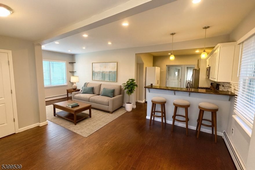 Introducing 11 Garfield Road. This 3-bedroom, 1-bath cape offers a comfortable layout in a great location. The updated kitchen features stainless steel appliances and a breakfast bar that opens into the main living area, making the space feel open and easy to use. Right next to Lake Parsippany, you'll be able to enjoy everything the lake has to offer walks by the water, fishing, relaxing in the sun, or just taking in the view. A well-located home, ready for its next chapter.