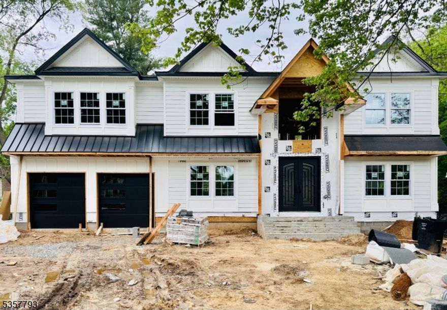 This stunning new construction, crafted by a highly regarded local builder, is nestled on one of Paramus's most sought-after streets. Offering approximately 5,000 square feet of luxurious living space, this exceptional home features 5 bedrooms and 6.5 full baths, built upon an existing foundation with soaring 9-foot ceilings. The first floor includes a versatile En-Suite Bedroom perfect for guests. Upstairs, the second floor showcases a grand primary suite with a spa-like bath and spacious walk-in closets. 3 private En-Suite Bedroom along with additional 4th bedroom and hall full bath. Designed for elegance and comfort, the home boasts a dramatic two-story entry, an open-concept layout, stunning coffered ceilings, custom millwork, a gourmet kitchen, and rich hardwood floors throughout. The fully finished basement offers additional 1000 sq feet of living space, living space, a media room, & full bath.