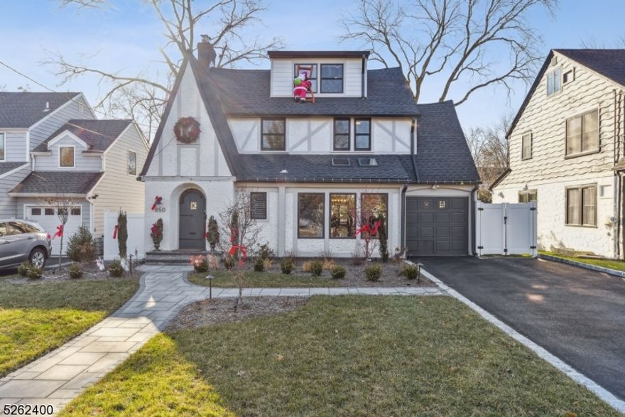 This gorgeous 5 bedroom home was totally gut renovated to perfection in 2022, has every single amenity and is ideally located walking distance to highly rated South Mountain Elementary (0.1 miles), Taylor Park & downtown Millburn (0.5 miles), train station (0.7 miles), & South Mountain Reservation (0.9 miles). Features a stunning open floor plan w/ family room totally open to gourmet eat-in kitchen, living room w/ wood-burning FP & custom built-ins, bright dining room, office/playroom w/ skylights, & mudroom w/ custom built-ins. Family room boasts 3 doors w/ access to a wrap-around deck overlooking level, fenced backyard w/ a Plunge Pool built by Endless Pools. 2nd level features a Primary Bedroom w/ 14' tray ceiling & incredible natural light, 2 WICs, a spa-like bath, 3 additional bedrooms, one with an en suite full bath, a full hall bath & laundry. 3rd level has a bedroom & full bath w/ great privacy. Beautifully finished lower level features a rec room. Incredible amenities include a Tesla charger, automated custom shades, automated Lutron lights, motion sensor lights in bathrooms & for kitchen cabinets, Arlo outdoor security cameras & doorbell and Abode security system, August front door lock, MyQ garage door, Ecobee 2-Zone Thermostats, Hunter Hydrawise sprinkler system, luxury pergola, & new roof (2022). The heated plunge pool has a year-round built-in pool cover, remote controlled LED lights, heating & cleaning, and serves as a great workout, a lazy river & jetted tub!