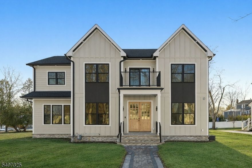 NEW CONSTRUCTION in one of Livingston's most sought-after neighborhoods, this distinguished CENTER HALL COLONIAL offers over 5,100 sq ft of sun-filled living space across 3 beautifully finished levels. A dramatic 2-story foyer sets a grand first impression, highlighted by hardwood floors & custom millwork throughout. The main level is designed for refined living & entertaining, featuring formal living & dining rooms, a spacious family room anchored by a statement FIREPLACE, a stylish powder room, & seamless flow. The gourmet chef's kitchen showcases premium appliances, custom cabinetry, a generous center island, & both a butler's pantry and walk-in pantry. Thoughtfully integrated smart home features, along with a fenced-in backyard & rear porch, extend everyday living outdoors. A private first-floor EN-SUITE bedroom offers comfort & privacy for guests. Upstairs, the primary suite is a serene retreat with a spa-inspired bath, his-and-her walk-in closets, and a private balcony. All additional bedrooms are EN-SUITES, and a second-floor laundry area adds everyday convenience. The fully finished lower level features a recreation room, media or theater room & an additional guest en-suite. A 2-car garage completes this exceptional offering. Additional highlights include designer finishes & a 10-year builder's warranty. Close to schools, shopping, parks, and NYC transportation.