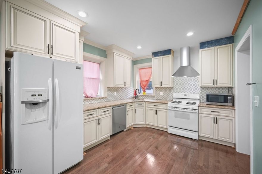 Welcome to 1342 Lake St! This charming Colonial was entirely restored from top to bottom. It has BRAND NEW EVERYTHING! The home is well situated in a peaceful and highly desirable section of Plainfield! The numerous upgrades and renovation have transformed 1342 Lake Street into the perfect nest! Featuring an updated kitchen with granite countertops, newer appliances and beautiful hardwood floors throughout. Offering 4 bedrooms, 2 Full renovated bathrooms and a 2 car-detached garage. The spacious front porch and the second-floor enclosed porch are just perfect for relaxation! The huge attic and basement with high ceiling clearance can be finished for extra living spaces; come and visualize it for yourself. You get new windows and doors, new electrical panel, new wiring throughout, new water tank, new furnace, new deck, new heating system, new plumbing (PEX), new draining system, new floors, new bathrooms and new kitchen, freshly painted inside and out, and many more upgrades. You can be in touch with nature on your own low maintenance backyard here. Near shopping, dining, recreation and transportation. Experience the best of both worlds, as you enjoy the peacefulness of the suburbs of NJ, while still being just a drive away from the vibrant energy of Manhattan. Public transportation includes the bus stop at Plainfield Ave, about 6 minutes-walk and a 17 minutes-walk to the Netherwood Train Station. Come and see it for yourself.
