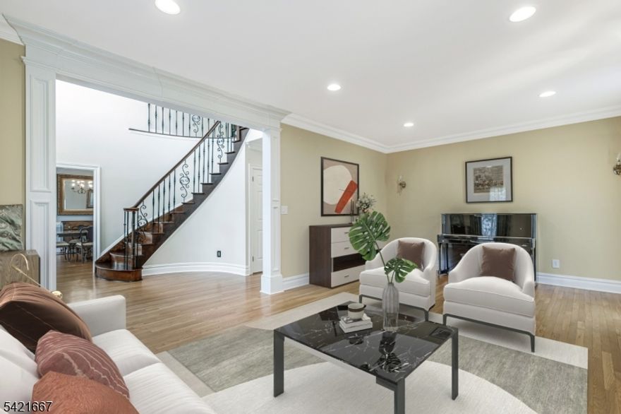 Set high on a picturesque street in one of Stony Hill's most sought-after neighborhoods, this stunning home offers elegance, space, and thoughtful design throughout. A grand 2-story entry welcomes you into a sun-drenched interior featuring gleaming hardwood floors across the first level. Formal living & dining rooms with detailed millwork flank the foyer, creating a warm and refined first impression. A custom butler's pantry with a wine refrigerator leads into the beautifully renovated chef's kitchen, which features granite countertops, a 6-burner Wolf range, commercial-grade appliances and a separate dining area. The kitchen flows seamlessly into the spacious family room with tile flooring, a wood-burning fireplace, & sliding doors that open to a private patio. Enjoy outdoor living in the level, manicured backyard featuring a custom paver patio and outdoor fireplace perfect for entertaining. A powder room, mudroom, and direct access to the 3-car garage complete the main level. Upstairs, wrought iron railings and dual stair access enhance both style and function. The luxurious primary suite features double-door entry, a sitting area, two walk-in closets, and an updated spa-like bath with radiant heated floors and a walk-in shower. A separate wing offers two additional bedrooms and a full bath, while a fourth oversized en-suite bedroom includes its own walk-in closet, full bath, and laundry area. A full unfinished basement offers endless possibilities to customize and expand.