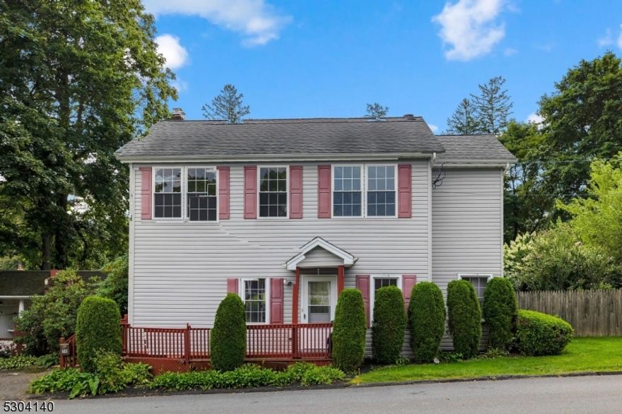 Beautiful double lot level backyard with perennial beds and Koi Pond is the pleasant surprise when you step out into the rear yard of this updated colonial.  Open floorplan on fist floor includes living room with hardwood flooring and wood burning fireplace, updated kitchen with all appliances included, dining area, powder room and mudroom/laundry room on first floor with access to huge deck with retractable awning for shade. Upstairs offers primary bedroom with huge walk-in closet plus 2 spacious bedrooms with ample closet space for storage and full bath.  Other features include central air, fenced yard, 3 storage sheds (as-is), breezeway to garage, thermal pane windows, low maintenance vinyl siding, pull down stairs to attic storage, natural gas heat, public water, public sewer.  Excellent Mt. Olive school system and minutes to Rts. 46 and 80, as well as all the shopping the International Trade Zone offers.
