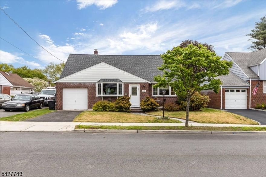 Welcome to this expanded cape style home. The first floor features a living and dining area, kitchen, 2 bedrooms and a full bath. Walk out from the kitchen to a large inviting deck surrounded by grass and greenery. The basement has ample space for play, laundry area and half bath. The upstairs has 2 more bedrooms and a bathroom. Well maintained home. Grab the opportunity to live on this peaceful, quiet dead-end block. Steps from Passaic Park and minutes walk to Houses of Worship.