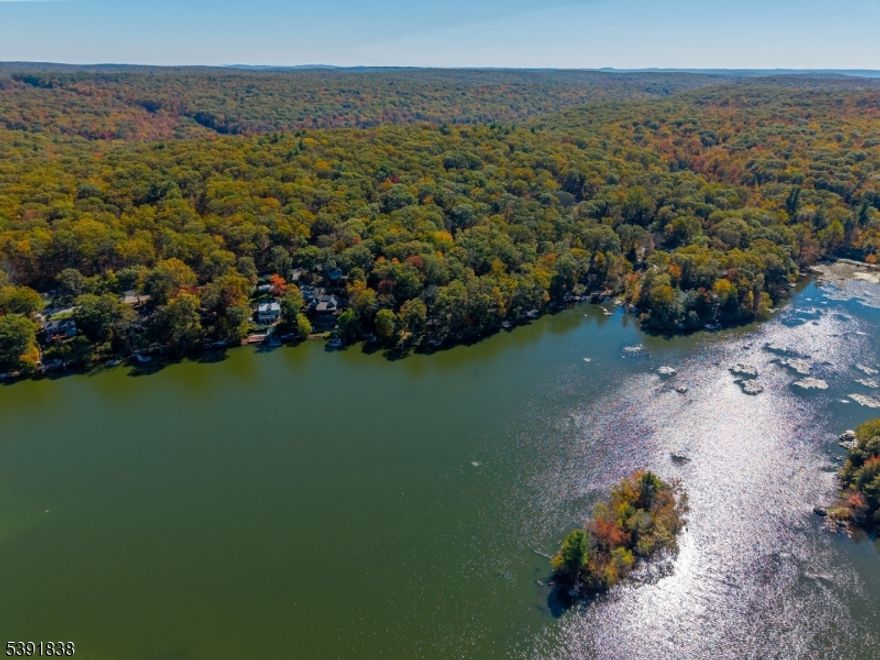 Build your dream home or weekend retreat in beautiful Highland Lakes With Lake Views! This 0.16-acre parcel offers a great opportunity to own land in one of Vernon's most desirable lake communities. Enjoy nearby beaches, boating, fishing, and year-round recreation just minutes from Mountain Creek Resort, hiking trails, and state parks. Convenient location with paved road frontage, electric at street, and lake rights through Highland Lakes Country Club. Easy access to major routes yet tucked away in a peaceful wooded setting. Buyer to perform due diligence for approvals, survey, and any building requirements.