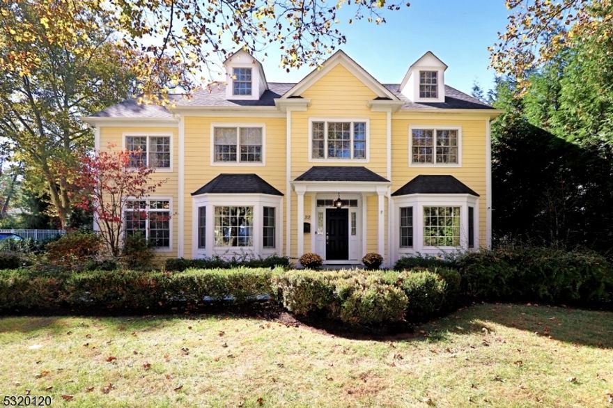 A town standout, this home has been catching the eye of passers by since it was built, and the captivating exterior is just the beginning!  Situated on one of the most coveted streets in town, this custom home is a true masterpiece, recognized for its award-winning design. Boasting 6 spacious bedrooms, 5.5 bathrooms and 4 finished levels of living space, this home offers both grandeur and comfort. A beautiful entryway invites you in, flanked the dining room & formal living room, setting the stage for the elegance throughout the home. The heart of this home is the large gourmet kitchen, featuring high-end appliances, custom cabinetry, and an expansive center island, making it perfect for both casual meals and large gatherings. The oversized island offers ample seating & overlooks the spacious great room. Whether preparing a meal or entertaining guests, the open-concept layout ensures everyone remains part of the action. Rounding out the first floor you'll love the beautifully appointed guest suite, perfect for visitors or home office.  The side entry opens to a cheerful mudroom, with custom cubbies.  The 3 car finished garage featuring custom walls with built-in hanging systems make organizing tools and gear a breeze. On the 2nd floor you'll find the laundry room and five bright and roomy bdrs w/ custom closets. The primary suite with 2 large walk-in closets, a sitting room, and a spa-like bathroom. The fully finished bsmnt offers a spacious rec room and a dedicated home gym.