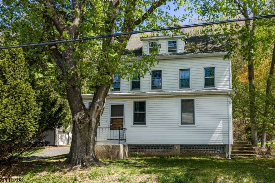 Tucked along Uniontown Rd in Lopatcong Twp, this circa 1900 Colonial farmhouse blends warmth, character, and possibility. This 4-bedroom, 1.5 bath in Lopatcong Elementary School district, features hardwood floors, a cozy family room with a wood-burning stove, oil forced hot air heat, and a home office perfect for remote work. The finished attic offers flexible space for a guest retreat or bonus room. With its historic charm, the home provides an opportunity to personalize and enhance over time. Step outside and discover what truly sets this property apart. Situated on 6.57 acres, including 5.57 acres farm assessed under a separate tax ID for harvesting firewood, this is a rare offering. For outdoor enthusiasts, it is truly a hunter's dream. Acres of private woods provide space to explore, enjoy nature, and hunt on your own land. The property rises behind the home and levels at the top, offering peaceful golf course views and exceptional privacy. A deck off the home perfect for entertaining, grilling, and evenings around a firepit. An above-ground pool with Trex decking is privately nestled among the trees. A large cleared yard area offers space for games, playground equipment, or target practice. Detached 20x20 garage. Replacement windows included for select areas.Conveniently located near shopping, dining, fairgrounds, golf, and major commuting routes, yet offering the land and lifestyle rarely found at this price point. Schedule your private showing today.