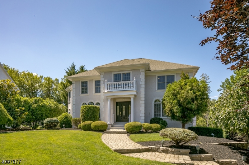 Gracious and updated 5/6 bedroom home on quiet cut-de-sac on Madison Hill! Grand foyer welcomes you to this beautiful home w hardwood floors and architectural detail throughout. Beautiful formal dining room and living rooms; wonderful library/office; gourmet kitchen w lg island, high-end appliances, pantry; GREAT ROOM off kitchen with fireplace, french doors to spectacular patio overlooking gardens and private yard. Second floor w master suite has NEW spa-like bath and beautiful sitting room. 4 additional bedrooms and 2 new gorgeous full baths round out the large 2nd floor. Lower level has rec room, exercise/bedroom with full bath, walk-out mudroom, playroom, laundry, storage & possible wine cellar. Attatched 3-car garage. Beautiful neighborhood close to town, train and school