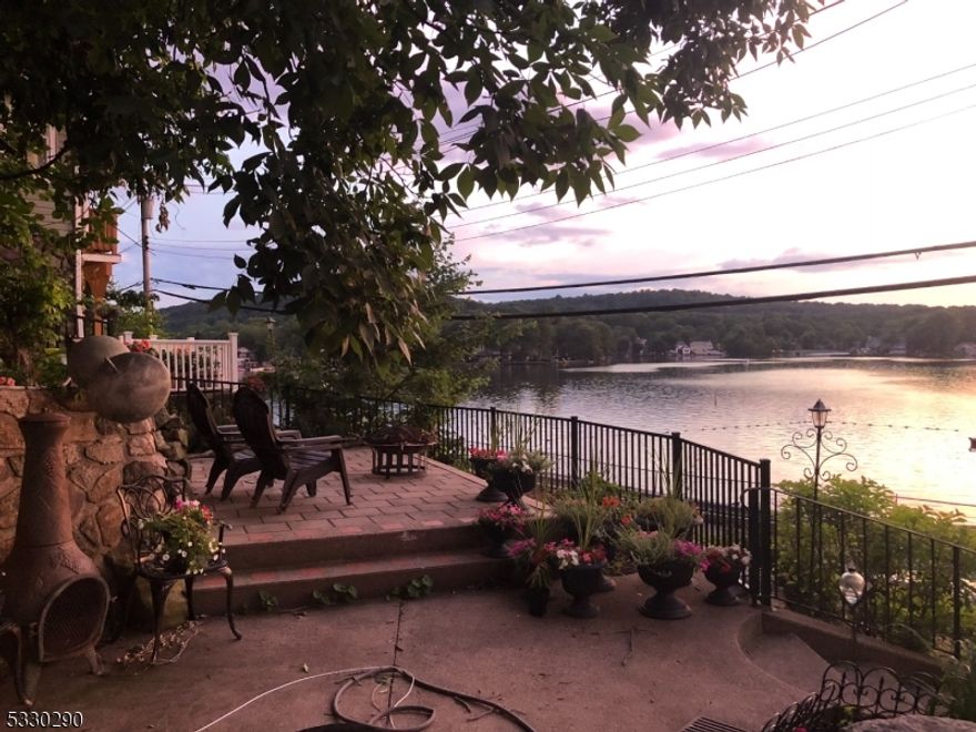 Beautifully renovated 2-bedroom apartment with a den, overlooking beautiful Indian Lake. This rental features a spacious living room and an updated eat-in kitchen with modern finishes and stainless steel appliances. Heat and hot water are included for added convenience. Enjoy on-site laundry and take in stunning lake views from your private outdoor patio. Located directly across from Indian Lake, with the option to join the lake (membership required). Private front and side entrances offer both convenience and privacy. Recent updates include new vinyl flooring, a renovated bathroom, and a new washer and dryer (2024). Ideally situated close to downtown with easy access to bus and train transportation. Don't miss this charming lakeside retreat!