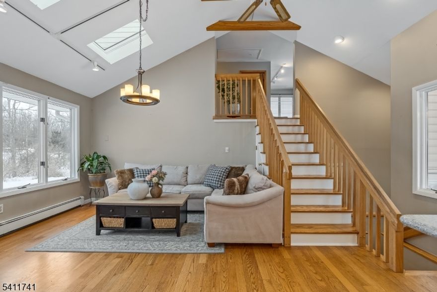 This possible 3 Bedroom  2 Full Bath  move-in ready home in Andover is tucked away on .98 acres, offers a rare combination of privacy, tranquilty, modern updates. Set back from the road & surrounded by natural barriers, & a serene pond and private dock right in your backyard. Imagine waking up to glowing sunrises and ending your day with breathtaking sunsets from the charming front porch. Inside, natural light pours into every room, creating a warm and inviting atmosphere. The oversized kitchen & open, flowing layout make entertaining effortless, while updated bathrooms & a cozy fireplace in the spacious dining room add character and comfort. The loft features built-ins and an electric fireplace and can easily be enclosed to create a true 3rd bedroom or private home office. A Juliet balcony off the primary overlooks the pond. The unfinished basement with high ceilings presents incredible potential for additional living space. Outside, enjoy the expansive deck while entertaining and taking the lush park like yard. The heated oversized two-car garage, &  paved driveway bring additional everyday comfort. Major upgrades include a 2024 roof, 2025 natural gas 3 zone furnace & hot water heater. Multi-zone central air, & whole-house water filtration offer additional peace of mind. With property taxes under $10,000 and convenient access to shopping, dining, and major commuter routes, this Andover home delivers lifestyle, location, and value in one unforgettable setting.