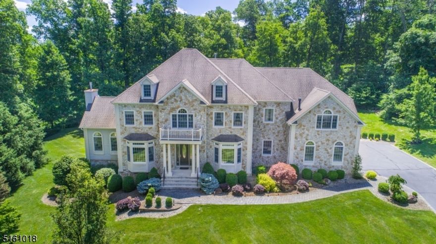 Quality, not your average tract home!  Stately and elegant, this custom colonial with stone facade is a dream come true! Magnificent professionally landscaped home site, bordered by woods and set on a quiet cul de sac is just minutes away from quaint downtown Chester.  With over 4000 square feet of living space, the details are what sets this home apart - 10' ceilings on first floor and 9' on the second, two staircases, dramatic cathedral ceilings, a variety of window styles, oversized moldings, custom closets throughout, oak flooring, custom window treatments and more.  The spacious rooms have an easy flow, ideal for both entertaining and comfortable everyday life.  An unfinished walkout basement with very high ceilings is ready for finishing and includes sliders to the outdoors.  2nd floor includes guest suite with private bath, J&J bedrooms with full bath and primary suite with luxurious bath, sitting room with fireplace and 2 walk-in closets.  Fantastic Chester schools and West Morris Mendham High School.