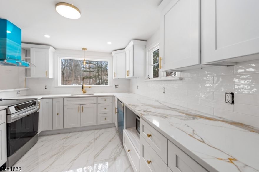 Come fall in love with this fully renovated Colonial set on 1.30 private acres in White Township. This beautifully updated 4-bedroom, 2 full bathroom home has been completely redone by an investor with attention to detail throughout. The brand-new kitchen features modern finishes, updated cabinetry, and a clean, contemporary design that flows seamlessly into the main living areas. Fresh paint and upgrades throughout give the home a bright, move-in-ready feel. Hardwood floors throughout as well. Enjoy peaceful mornings or relaxing evenings on the wraparound porch overlooking a tranquil stream   a rare and scenic setting just minutes from town conveniences and Pocono attractions. The full basement has been completely renovated, offering additional living or recreational space. With updated systems, stylish finishes, and expanded bedroom/bath count, this home combines charm, space, and modern updates in one turnkey package. Move right in and enjoy.