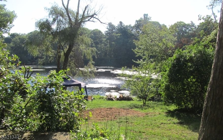 Single-family lakefront home with private access and scenic views.