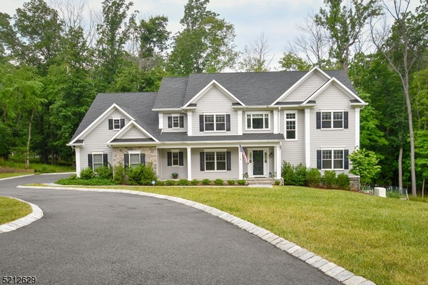 Beautiful custom Colonial house newly constructed in 2018, on quiet cul de sac with similar,  beautiful custom built houses.  Minutes to highways, schools, shopping and restaurants.  Neutral decor throughout. Spacious entry with custom moldings, wainscotting, and hardwood floors, leading to the formal dining room and the open-concept Great room complete with high, coffered ceiling, and wall of windows overlooking the deck and yard. Gourmet kitchen with quartzite counters, glass tile backsplash, top of the line appliances, and large center island.   Spacious eating area with wall of windows and door to deck. Large mud room off kitchen with access to 3 car garage.Walk in pantry.  First floor guest suite. Spacious primary suite with double walk-in closets, luxurious bath, and sitting room. Three additional bedrooms on second floor, all with attached bathroom. Second floor laundry room. Walkout lower level with in law suite, rec room, exercise room, and access to two-level  patio with custom fire pit. Hardwood floors in most rooms; custom tile baths. 5900 sq ft of living space, inc finished, walk out lower level. Whole house generator. (NOTE: Underground lawn sprinklers in front only. And in vegetable garden)