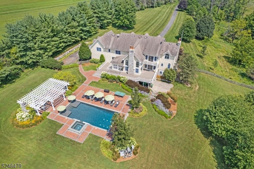 Welcome to "Fox Chase"- an absolutely stunning stone front Custom Colonial that is the ne plus ultra of gracious living with over 5,870 sq ft of luxury living space on the two upper floors, plus the added convenience of a sprawling lower level with walkouts to a sparkling in-ground swimming pool with bubbling spa, wrap-around rear deck, expansive brick patio with pergola, fireplace, and outdoor kitchen, and privately sited on nearly 13 acres including wonderful showcase gardens in a coveted, commuter-friendly east Chester Township estate neighborhood.  13 rooms including 5 airy bedrooms (all with en suite bath access), 5 full baths, powder room, 3 fireplaces, grand foyer ,lovely living room, spectacular great room has a wet bar, gorgeous gourmet designer kitchen with radiant breakfast room and enormous walk-in pantry closet, handsome home office that can double as a first floor guest/in-law suite with its en suite full bath, resplendent sunroom, formal dining room has a butler's pantry, and primary bedroom suite w spacious sitting room, dressing room, romantic gas fireplace, and sumptuous bath.  Three-car garage with long, private driveway and round paver courtyard area. Enjoy the timeless splendor of this special home!